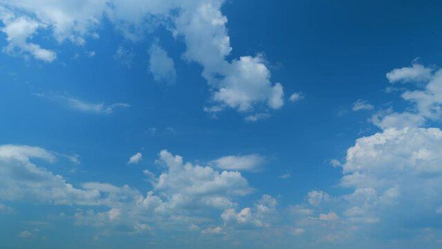 Blue sky with copyspace background with forming clouds in Summer day outdoors. Time lapse.