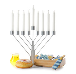 Menorah with candles, cookies, donuts and honey for Hanukkah celebration on white background