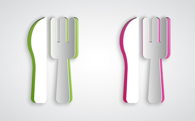 Paper cut Crossed knife and fork icon isolated on grey background. Cutlery symbol. Paper art style. Vector