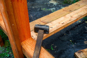 Fototapeta na wymiar sledgehammer abandoned on the foundation