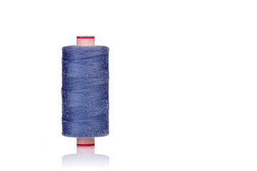 a skein of threads of blue color macro on a white background