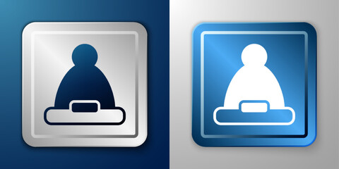 White Christmas Santa Claus hat icon isolated on blue and grey background. Merry Christmas and Happy New Year. Silver and blue square button. Vector