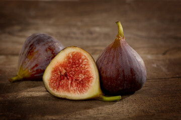 Organic fresh figs on wooden background