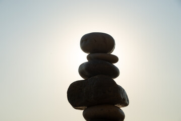 pebbles on top of each other on a beach