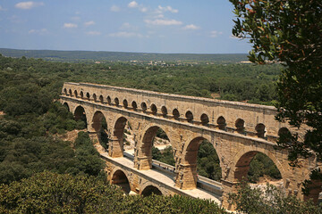 Obraz premium Pont du Gard, Gard, Occitanie, France: famous Roman aqueduct over Gardon river: general view from south bank