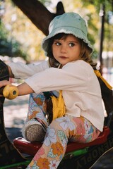 little hippie child playing on playground in varna bapha bulgaria, model shooting, happy,...