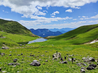 trekking at lake Dimon on the mountains of the Carnic Alps