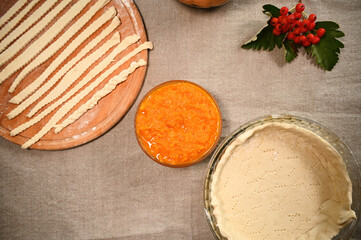 Top view: Fresh raw ingredients for making an American traditional pumpkin classic pie with a crispy crust. Copy advertising space. Thanksgiving Day. Flat lay. Still life