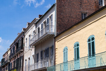 Naklejka premium Row of Colorful and Beautiful Old Buildings with Balconies in the French Quarter of New Orleans