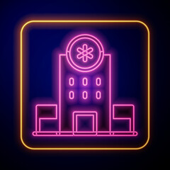 Glowing neon Medical hospital building with cross icon isolated on black background. Medical center. Health care. Vector