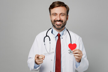 Male doctor man in white medical gown suit work in hospital show red paper heart mockup point...