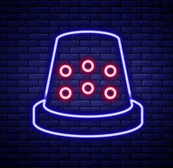 Glowing neon line Thimble for sewing icon isolated on brick wall background. Colorful outline concept. Vector