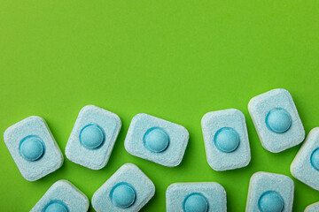 Water softener tablets on green background
.FLAT LAY. Place for text.Space for copy.Top view....