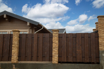 Modern fence around the house.Design and architecture of a modern house.