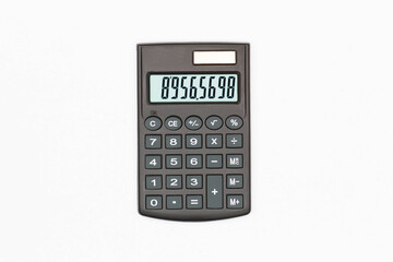 Calculator with big buttons with numbers on the digital screen on a white background. Isolated. Solar powered financial calculator. Electronic machine for math. Business office supplies. Close-Up