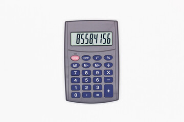 Calculator with blue buttons with numbers on the digital screen on a white background. Isolated. Solar powered financial calculator. Electronic machine for math. Business office supplies. Close-Up
