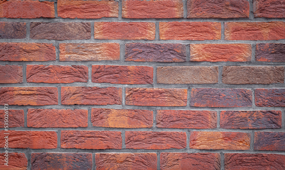 Poster old red brick wall grunge texture. old seamless cracked bricks wall with a weathered surface with wi