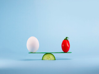 Healthy eating and food balance concept with food on a seesaw