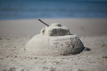 t-34 tank made of sand on the beach
