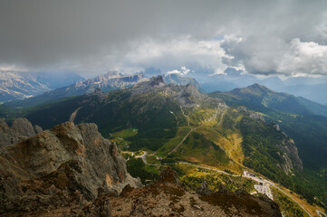 Panoramic view in Dolomites, Sun breaking through the dark sky in the mountains, Dolomites, Italian Alps, Italy, Europe