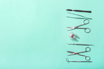 Dental instruments on color background