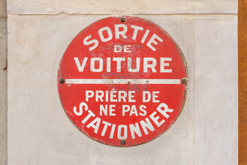 vehicles exit sign in Paris, France. To make people aware not to park