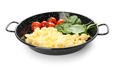 Frying pan with tasty scrambled eggs, tomatoes and greens on white background