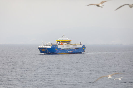 Ferryboat taking people and their cars from continental Greece to the island of Thassos in the Thracian Sea.