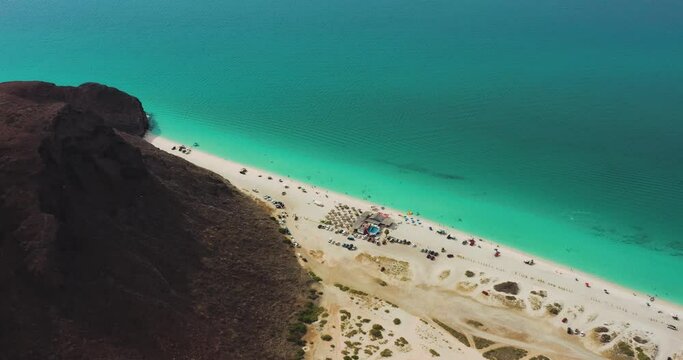 aerial drone view of the wonderful Tecolote beach with crystal clear waters in La Paz Baja California