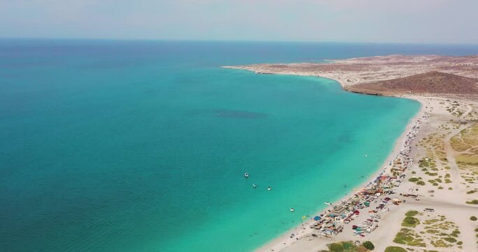 aerial drone view of the wonderful Tecolote beach with crystal clear waters in La Paz Baja California
