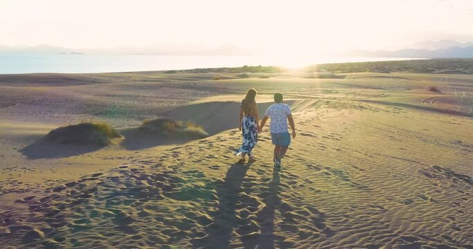 Couple enjoying the beautiful desert and great sand dunes