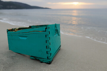 Wood, plastic and even wooden bee hives washed ashore on the Golden Beach in Thassos after a...