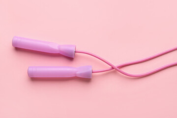 Skipping rope on pink background