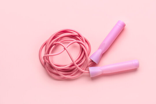 Skipping rope on pink background