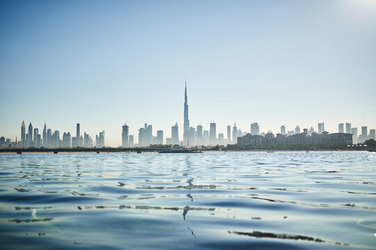 view of Dubai skyline over the water surface