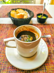 Cup of americano black coffee in restaurant Mexico.