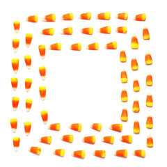 Frame made of Halloween candy corns on white background