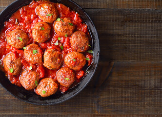 Fried meatballs with tomato sauce