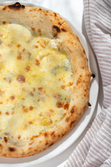 Cinque Formaggi or Five-Cheese Pizza on white background for restaurant menu.