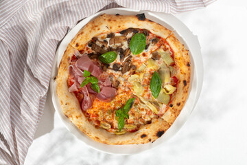 Pizza Quatro Stagioni four seasons traditional italian meal from artichokes mushrooms tomatoes ham...