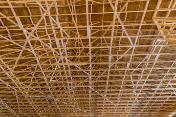As wooden trusses beamis being constructed of new house