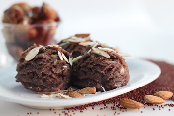 Ragi dates Sheera. Indian pudding made of finger millet flour ghee, milk, dates and dry fruits. Traditionally known as ragi halwa.