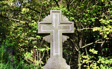 Cross of a grave. Memorial stone of the dead.