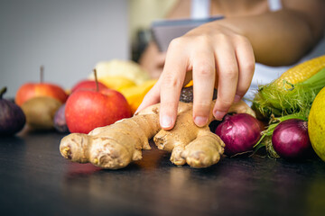 Close-up, ginger root on the kitchen table.