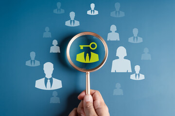 HRM or Human Resource Management, Magnifier glass focus to manager unlock business key icon which is among staff icons for human development recruitment leadership and customer target group concept.