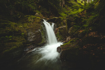 Unspoilt nature with beautiful waterfall around the Hochwechsel mountains in the region of Styria, Austria. Green-brown tinge photos