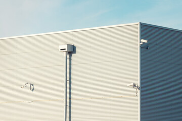 Factory building. Surveilance cameras on a industrial building facade.