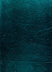 Grain texture overlay. Dust scratches noise. Weathered concrete wall. Teal blue particles on rough dark grunge abstract illustration background.