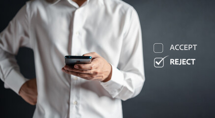 Businessman using smartphone touch incorrect mark button to reject document and project concept.