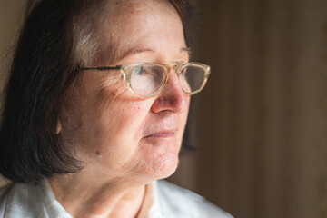 Portrait of an elderly woman with eyeglasses. Vision problems